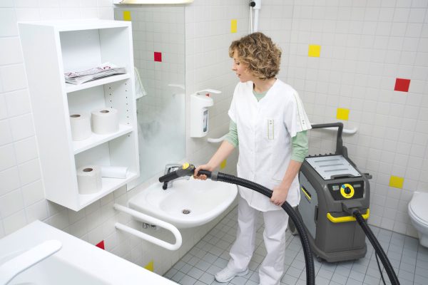 Woman uses SGV 6/5 steam vacuum cleaner